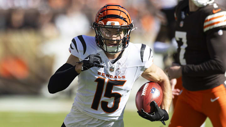 Oct 20, 2024; Cleveland, Ohio, USA; Cincinnati Bengals wide receiver Charlie Jones (15) returns the opening kickoff for a touchdown against the Cleveland Browns during the first quarter at Huntington Bank Field. Mandatory Credit: Scott Galvin-Imagn Images
