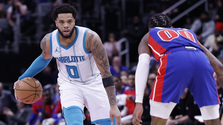 Jan 3, 2025; Detroit, Michigan, USA; Charlotte Hornets forward Miles Bridges (0) dribbles against Detroit Pistons forward Ronald Holland II (00) in the first half at Little Caesars Arena. Mandatory Credit: Rick Osentoski-Imagn Images Jan 3, 2025; Detroit, Michigan, USA; Charlotte Hornets forward Miles Bridges (0) dribbles against Detroit Pistons forward Ronald Holland II (00) in the first half at Little Caesars Arena. Mandatory Credit: Rick Osentoski-Imagn Images
