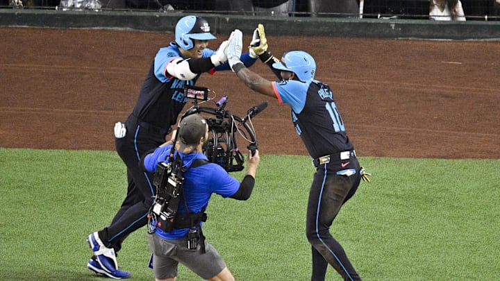 Jul 16, 2024; Arlington, Texas, USA; National League outfielder Jurickson Profar of the San Diego Padres (10) and National League designated hitter Shohei Ohtani of the Los Angeles Dodgers (17) celebrate after Ohtani hits a three run home rune against the American League during the third inning of the 2024 MLB All-Star game at Globe Life Field. Mandatory Credit: Jerome Miron-Imagn Images