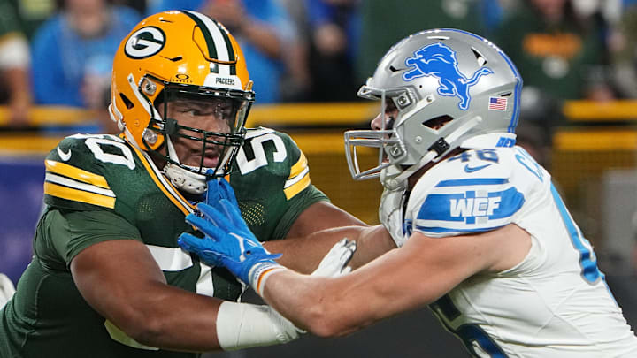 Sep 28, 2023; Green Bay, Wisconsin, USA; Green Bay Packers guard Zach Tom (50) moves in against Detroit Lions linebacker Jack Campbell (46) during the first quarter at Lambeau Field. Mandatory Credit: Mark Hoffman-Imagn Images