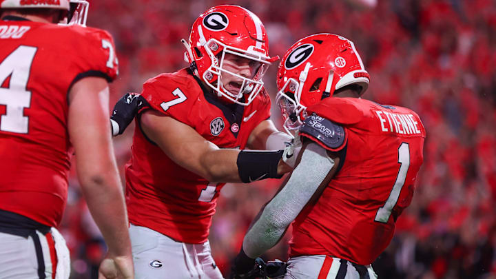 Oct 12, 2024; Athens, Georgia, USA; Georgia Bulldogs running back Trevor Etienne (1) celebrates after a touchdown with tight end Lawson Luckie (7) against the Mississippi State Bulldogs in the fourth quarter at Sanford Stadium. Mandatory Credit: Brett Davis-Imagn Images
Oct 12, 2024; Athens, Georgia, USA; Georgia Bulldogs running back Trevor Etienne (1) celebrates after a touchdown with tight end Lawson Luckie (7) against the Mississippi State Bulldogs in the fourth quarter at Sanford Stadium. Mandatory Credit: Brett Davis-Imagn Images