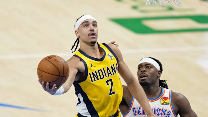 Indiana Pacers guard Andrew Nembhard (2) shoots the ball against Oklahoma City Thunder guard Luguentz Dort (5) during the third quarter in game one of the 2025 NBA Finals at Paycom Center. Indiana Pacers guard Andrew Nembhard (2) shoots the ball against Oklahoma City Thunder guard Luguentz Dort (5) during the third quarter in game one of the 2025 NBA Finals at Paycom Center.