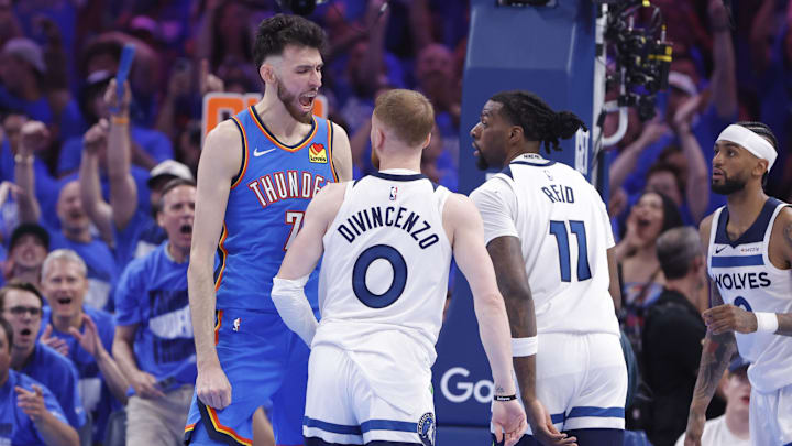 May 22, 2025; Oklahoma City, Oklahoma, USA; Oklahoma City Thunder forward Chet Holmgren (7) reacts after dunking against Minnesota Timberwolves guard Donte DiVincenzo (0) in the third quarter during game two of the western conference finals for the 2025 NBA Playoffs at Paycom Center. Mandatory Credit: Alonzo Adams-Imagn Images