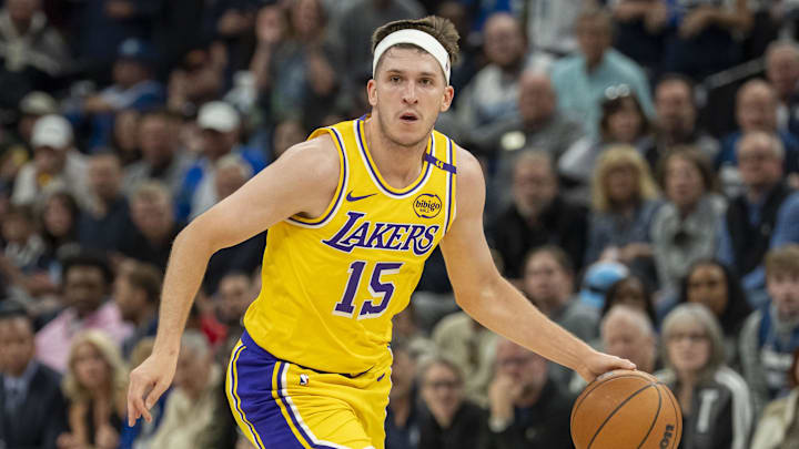 Apr 25, 2025; Minneapolis, Minnesota, USA; Los Angeles Lakers guard Austin Reaves (15) dribbles the ball against the Minnesota Timberwolves during game three of first round for the 2024 NBA Playoffs at Target Center. Mandatory Credit: Jesse Johnson-Imagn Images