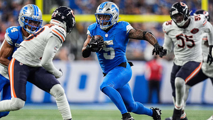 Detroit Lions running back David Montgomery powers through the Bears defense in the first half Sunday.
