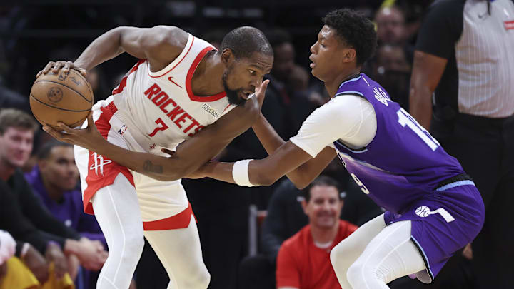 Oct 8, 2025; Houston, Texas, USA; Houston Rockets forward Kevin Durant (7) controls the ball as Utah Jazz forward Ace Bailey (19) defends during the second quarter at Toyota Center. Mandatory Credit: Troy Taormina-Imagn Images