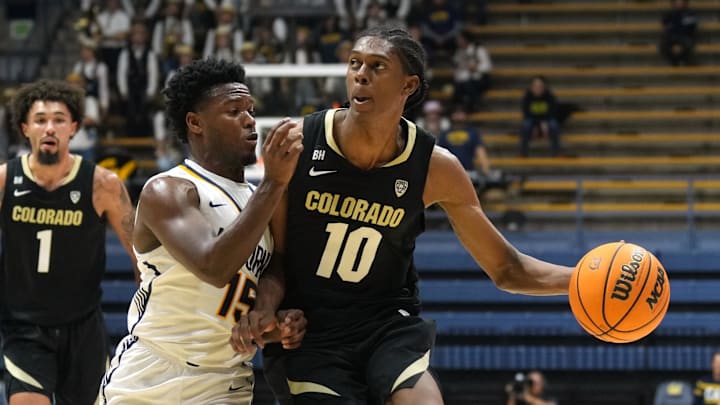 Jan 10, 2024; Berkeley, California, USA; Colorado Buffaloes forward Cody Williams (10) dribbles against California Golden Bears guard Jalen Cone (15) during the first half at Haas Pavilion. Mandatory Credit: Darren Yamashita-USA TODAY Sports