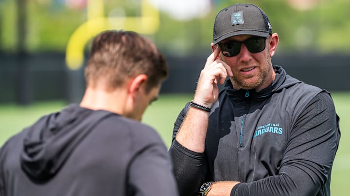Jacksonville Jaguars general manager James Gladstone, left, talks with Jacksonville Jaguars head coach Liam Coen, right, after the. Jacksonville Jaguars’ mandatory minicamp Tuesday June 10, 2025 at the Miller Electric Center in Jacksonville, Fla. [Doug Engle/Florida Times-Union]