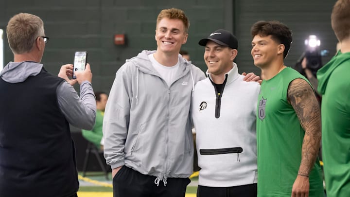 Denver Broncos quarterback Bo Nix, a former Oregon quarterback, left, and Oregon quarterback Dillon Gabriel, right, take a picture with Oregon offensive coordinator and quarterbacks coach Will Stein during the Oregon football’s Pro Day Tuesday, March 18, 2025, at the Moshofsky Center in Eugene, Ore. Denver Broncos quarterback Bo Nix, a former Oregon quarterback, left, and Oregon quarterback Dillon Gabriel, right, take a picture with Oregon offensive coordinator and quarterbacks coach Will Stein during the Oregon football’s Pro Day Tuesday, March 18, 2025, at the Moshofsky Center in Eugene, Ore.