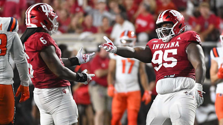 Sep 20, 2025; Bloomington, Indiana, USA; Indiana Hoosiers defensive lineman Mikail Kamara (6) and Indiana Hoosiers defensive lineman Tyrique Tucker (95) celebrate after a sack during the first half against the Illinois Fighting Illini at Memorial Stadium. Mandatory Credit: Robert Goddin-Imagn Images
