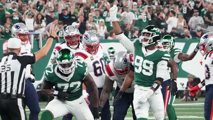 Sep 19, 2024; East Rutherford, New Jersey, USA; New England Patriots quarterback Jacoby Brissett (7) sacked by New York Jets defensive end Micheal Clemons (72) and defensive end Will McDonald IV (99) in the 1st half at MetLife Stadium. Sep 19, 2024; East Rutherford, New Jersey, USA; New England Patriots quarterback Jacoby Brissett (7) sacked by New York Jets defensive end Micheal Clemons (72) and defensive end Will McDonald IV (99) in the 1st half at MetLife Stadium.
