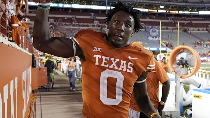 Oct 1, 2022; Austin, Texas, USA; Texas Longhorns linebacker DeMarvion Overshown (0) greets fans after a victory over the West Virginia Mountaineers at Darrell K Royal-Texas Memorial Stadium. Mandatory Credit: Scott Wachter-Imagn Images Oct 1, 2022; Austin, Texas, USA; Texas Longhorns linebacker DeMarvion Overshown (0) greets fans after a victory over the West Virginia Mountaineers at Darrell K Royal-Texas Memorial Stadium. Mandatory Credit: Scott Wachter-Imagn Images