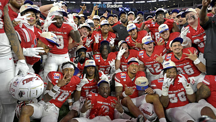 The UNLV Rebels celebrate after defeating the California Golden Bears in the LA Bowl at SoFi Stadium. The UNLV Rebels celebrate after defeating the California Golden Bears in the LA Bowl at SoFi Stadium.