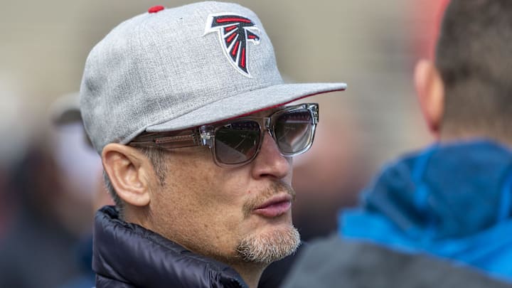 Former Atlanta Falcons NFL general manager Thomas Dimitroff chats on the sidelines during Senior Bowl practice at Ladd-Peebles Stadium.