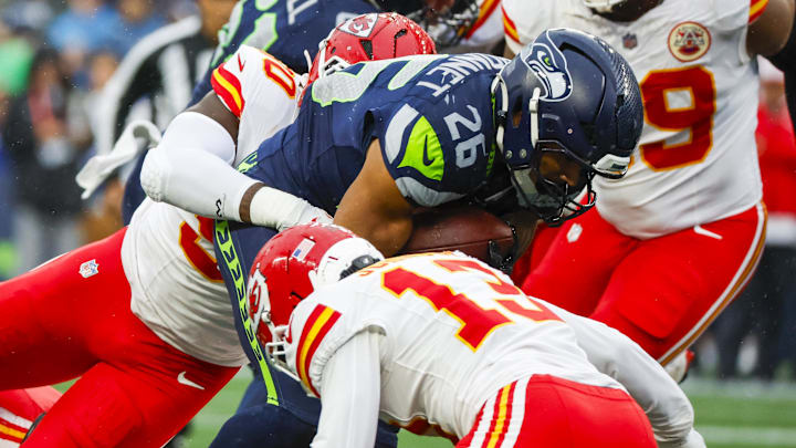 Aug 15, 2025; Seattle, Washington, USA; Seattle Seahawks running back Zach Charbonnet (26) rushes against the Kansas City Chiefs during the first quarter at Lumen Field. Aug 15, 2025; Seattle, Washington, USA; Seattle Seahawks running back Zach Charbonnet (26) rushes against the Kansas City Chiefs during the first quarter at Lumen Field.