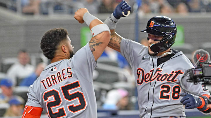 May 16, 2025; Toronto, Ontario, CAN;  Detroit Tigers center fielder Javier Baez (28) is greeted by second baseman Gleyber Torres (25) after hitting a solo home run against the Toronto Blue Jays in the eighth inning at Rogers Centre.