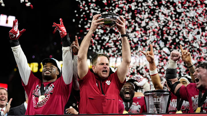 Indiana head coach Curt Cignetti hoists the trophy after winning the Big Ten championship game. Will the No. 1 Hoosiers claim their first football national championship this season? 