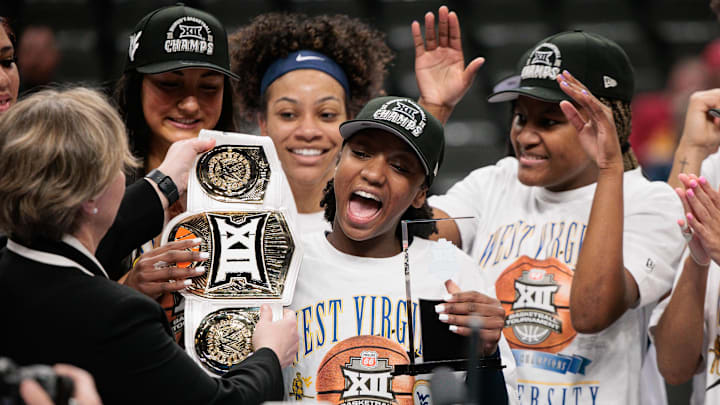 Mar 8, 2026; Kansas City, MO, USA; West Virginia Mountaineers guard Jordan Harrison (10) accepts the player of the game trophy after the game against the TCU Horned Frogs at T-Mobile Center. Mandatory Credit: William Purnell-Imagn Images Mar 8, 2026; Kansas City, MO, USA; West Virginia Mountaineers guard Jordan Harrison (10) accepts the player of the game trophy after the game against the TCU Horned Frogs at T-Mobile Center. Mandatory Credit: William Purnell-Imagn Images