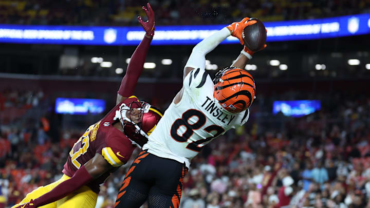 Cincinnati Bengals wide receiver Mitchell Tinsley (82) catches a touchdown pass over Washington Commanders cornerback Car'lin Vigers (22) during the first half at Northwest Stadium.