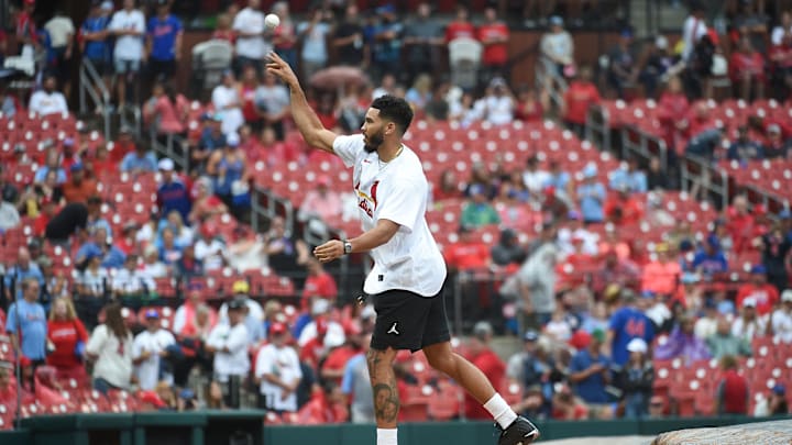 Boston Celtics forward Jayson Tatum throws out a ceremonial first pitch prior to a game between the St. Louis Cardinals and the Chicago Cubs at Busch Stadium. 
