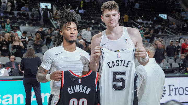 Nov 7, 2024; San Antonio, Texas, USA;  San Antonio Spurs guard Stephon Castle (5) and Portland Trail Blazers center Donovan Clingan (23) after a game at Frost Bank Center. Mandatory Credit: Daniel Dunn-Imagn Images