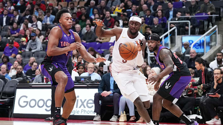 Oct 23, 2024; Toronto, Ontario, CAN; Cleveland Cavaliers guard Caris LeVert (3) drives to the basket as Toronto Raptors forward Scottie Barnes (4) tries to defend during the third quarter at Scotiabank Arena. Mandatory Credit: Nick Turchiaro-Imagn Images Oct 23, 2024; Toronto, Ontario, CAN; Cleveland Cavaliers guard Caris LeVert (3) drives to the basket as Toronto Raptors forward Scottie Barnes (4) tries to defend during the third quarter at Scotiabank Arena. Mandatory Credit: Nick Turchiaro-Imagn Images