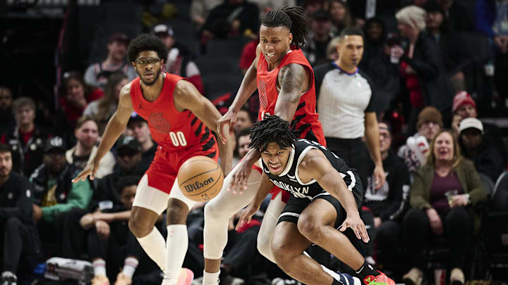 Jan 17, 2024; Portland, Oregon, USA; Portland Trail Blazers forward Jabari Walker (34) is called for a foul during the second half against Brooklyn Nets guard Cam Thomas (24) at Moda Center. Mandatory Credit: Troy Wayrynen-Imagn Images