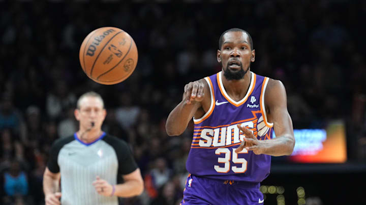 Feb 14, 2024; Phoenix, Arizona, USA; Phoenix Suns forward Kevin Durant (35) passes the against the Detroit Pistons  at Footprint Center. Mandatory Credit: Joe Camporeale-Imagn Images