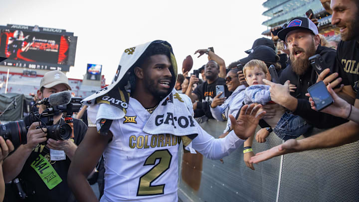 Oct 19, 2024; Tucson, Arizona, USA; Colorado Buffalos quarterback Shedeur Sanders (2) greets fans after defeating the Arizona Wildcats at Arizona Stadium. Mandatory Credit: Mark J. Rebilas-Imagn Images Oct 19, 2024; Tucson, Arizona, USA; Colorado Buffalos quarterback Shedeur Sanders (2) greets fans after defeating the Arizona Wildcats at Arizona Stadium. Mandatory Credit: Mark J. Rebilas-Imagn Images