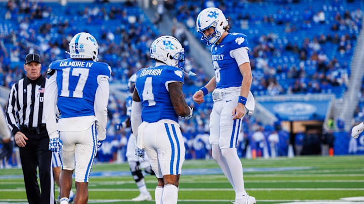 Nov 16, 2024; Lexington, Kentucky, USA; Kentucky Wildcats quarterback Cutter Boley (8) celebrates with running back Chip Trayanum (4) after carrying the ball for a first down during the third quarter against the Murray State Racers at Kroger Field. Mandatory Credit: Jordan Prather-Imagn Images