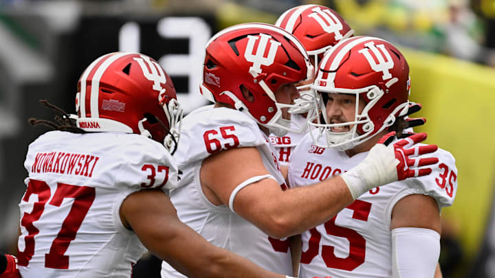 Oct 11, 2025; Eugene, Oregon, USA; Indiana Hoosiers placekicker Brendan Franke (35) celebrates with offensive lineman Carter Smith (65) and tight end Riley Nowakowski (37) after kicking a 58-yard field goal against the Oregon Ducks during the second quarter at Autzen Stadium. Mandatory Credit: Troy Wayrynen-Imagn Images
