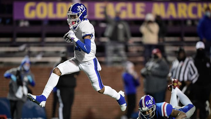 McCallie's Eric Rivers (11) goes in for a touchdown as MUS    Tylyn Young (3) defends during the second quarter of the Division II-AAA BlueCross Bowl Football Championship game at Tucker Stadium in Cookeville, Tenn., Thursday, Dec. 3, 2020.
