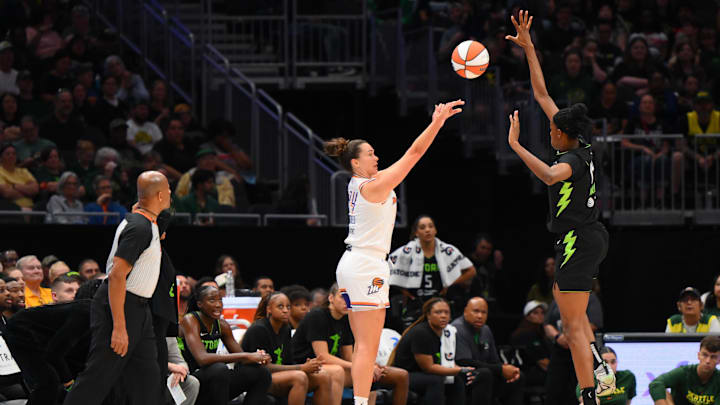 Aug 17, 2025; Seattle, Washington, USA; Phoenix Mercury forward Kathryn Westbeld (24) shoots the ball over Seattle Storm center Dominique Malonga (14) during the second half at Climate Pledge Arena. Mandatory Credit: Steven Bisig-Imagn Images