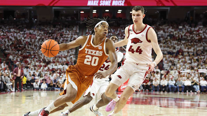 Feb 26, 2025; Fayetteville, Arkansas, USA; Arkansas Razorbacks forward Zvonimir Ivisic (44) defends against Texas Longhorns guard Tre Johnson (20) during the second half at Bud Walton Arena. Mandatory Credit: Nelson Chenault-Imagn Images Feb 26, 2025; Fayetteville, Arkansas, USA; Arkansas Razorbacks forward Zvonimir Ivisic (44) defends against Texas Longhorns guard Tre Johnson (20) during the second half at Bud Walton Arena. Mandatory Credit: Nelson Chenault-Imagn Images