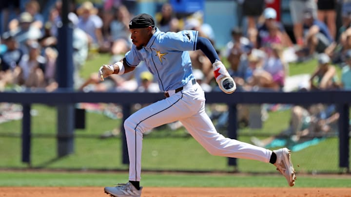 Mar 15, 2025; Port Charlotte, Florida, USA;  Tampa Bay Rays outfielder Chandler Simpson (96) steals second be during the third inning against the New York Yankees at Charlotte Sports Park. Mandatory Credit: Kim Klement Neitzel-Imagn Images