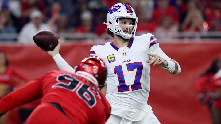Buffalo Bills quarterback Josh Allen (17) throws a pass against Houston Texans defensive end Denico Autry (96) in the second quarter at NRG Stadium.