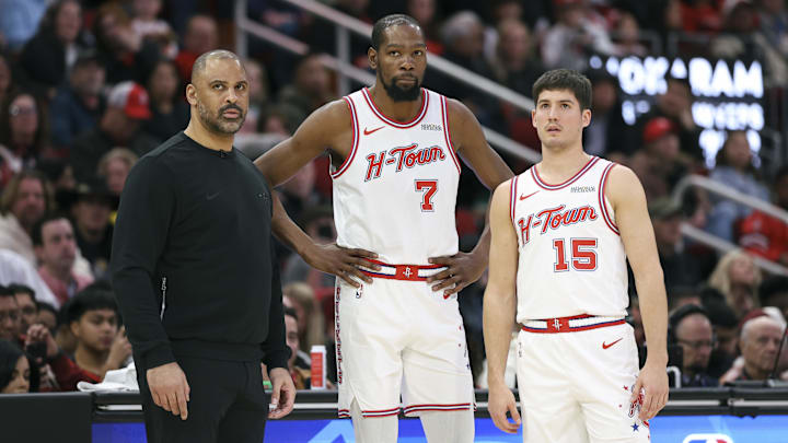 Jan 31, 2026; Houston, Texas, USA; Houston Rockets head coach Ime Udoka and forward Kevin Durant (7) and guard Reed Sheppard (15) look on during a play during the first quarter against the Dallas Mavericks at Toyota Center. Mandatory Credit: Troy Taormina-Imagn Images