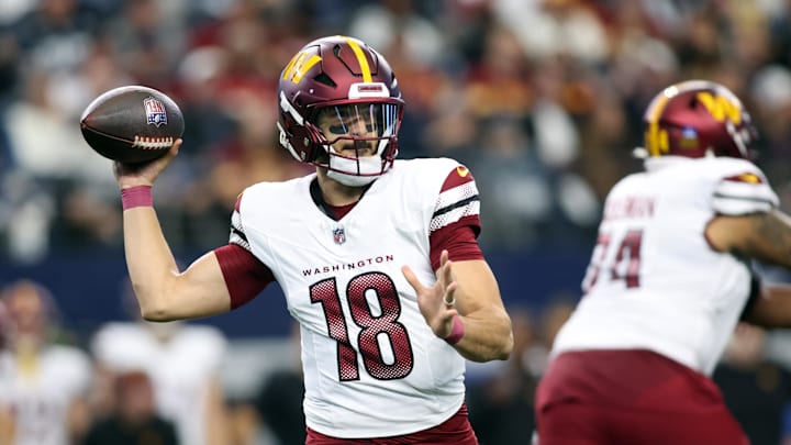 Jan 5, 2025; Arlington, Texas, USA; Washington Commanders quarterback Marcus Mariota (18) throws a pass against the Dallas Cowboys during the third quarter at AT&T Stadium. Mandatory Credit: Tim Heitman-Imagn Images