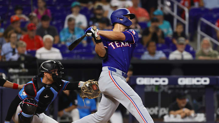 Jun 2, 2024; Miami, Florida, USA; Texas Rangers shortstop Corey Seager (5) hits a single against the Miami Marlins during the first inning at loanDepot Park. Mandatory Credit: Sam Navarro-USA TODAY Sports Jun 2, 2024; Miami, Florida, USA; Texas Rangers shortstop Corey Seager (5) hits a single against the Miami Marlins during the first inning at loanDepot Park. Mandatory Credit: Sam Navarro-USA TODAY Sports