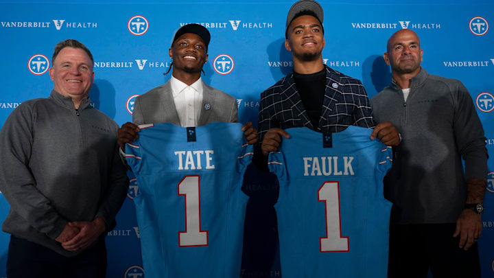 Tennessee Titans first round draft picks wide receiver Carnell Tate, second left, and edge Keldric Faulk stand for pictures with Mike Borgonzi, general manager, left, and Coach Robert Saleh at Vanderbilt Health Football Center Friday, April 24, 2026.