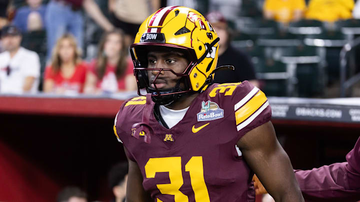 Dec 26, 2025; Phoenix, AZ, USA; Minnesota Golden Gophers running back Xavier Ford (31) against the New Mexico Lobos during the Rate Bowl at Chase Field. Mandatory Credit: Mark J. Rebilas-Imagn Images