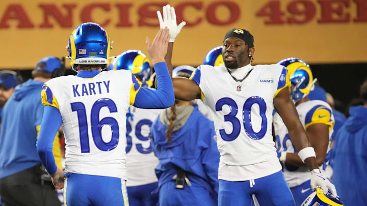 Dec 12, 2024; Santa Clara, California, USA; Los Angeles Rams kicker Joshua Karty (16) high fives cornerback Josh Wallace (30) after scoring a field goal against the San Francisco 49ers during the fourth quarter at Levi's Stadium. Mandatory Credit: Kelley L Cox-Imagn Images Dec 12, 2024; Santa Clara, California, USA; Los Angeles Rams kicker Joshua Karty (16) high fives cornerback Josh Wallace (30) after scoring a field goal against the San Francisco 49ers during the fourth quarter at Levi's Stadium. Mandatory Credit: Kelley L Cox-Imagn Images
