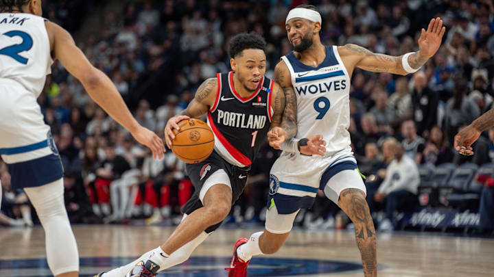 Portland Trail Blazers guard Anfernee Simons dribbles against Minnesota Timberwolves guard Nickeil Alexander-Walker in the second quarter at Target Center in Minneapolis on Feb. 8, 2025.