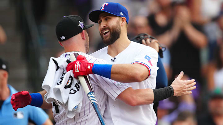 Texas Rangers right fielder Joey Gallo is greeted by Colorado Rockies shortstop Trevor Story during the 2021 MLB Home Run Derby. 