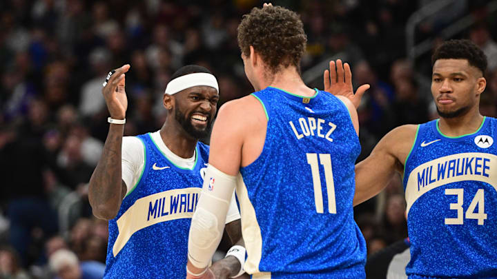 Feb 12, 2024; Milwaukee, Wisconsin, USA; Milwaukee Bucks forward Bobby Portis (9), center Brook Lopez (11 and forward Giannis Antetokounmpo (34) celebrate after a score in the fourth quarter against the Denver Nuggets at Fiserv Forum. Mandatory Credit: Benny Sieu-Imagn Images