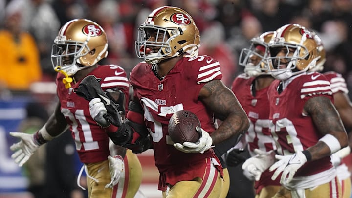 San Francisco 49ers linebacker Dre Greenlaw (57) celebrates his interception during the third quarter of their NFC divisional playoff game Saturday, January 20, 2024 at Levi    Stadium in Santa Clara, California. The San Francisco 49ers beat the Green Bay Packers 24-21.