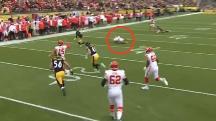 Kansas City Chiefs quarterback Patrick Mahomes scrambles and looks downfield to running back Samaje Perine during a Christmas Day game vs. the Pittsburgh Steelers at Acrisure Stadium. 