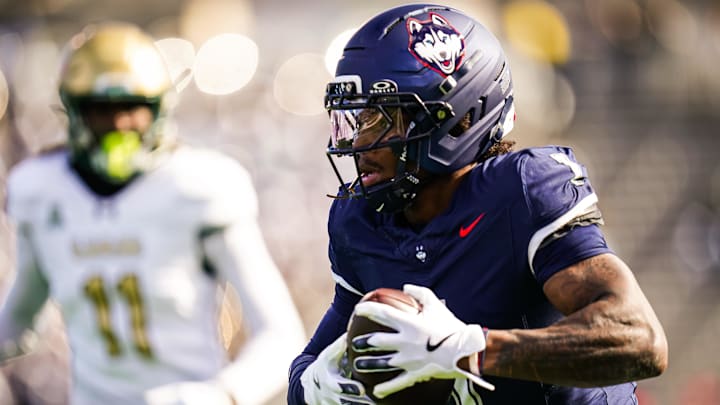 Nov 1, 2025; East Hartford, Connecticut, USA; UConn Huskies wide receiver Skyler Bell (1) makes the catch and runs for a touchdown against the UAB Blazers in the first quarter at Pratt & Whitney Stadium at Rentschler Field. Mandatory Credit: David Butler II-Imagn Images