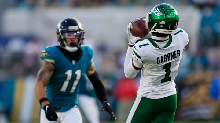 New York Jets cornerback Sauce Gardner (1) hauls in an interception against Jacksonville Jaguars wide receiver Parker Washington (11) during the fourth quarter Sunday, Dec. 15, 2024 at EverBank Stadium in Jacksonville, Fla. The Jets held off the Jaguars 32-25. [Corey Perrine/Florida Times-Union]