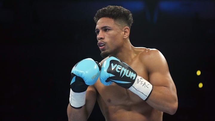 Feb 8, 2024; Las Vegas, Nevada, USA;  Teofimo Lopez (black/gold/red trunks) and Jamaine Ortiz (black trunks) box during their WBO Junior Welterweight World Title bout at Michelob ULTRA Arena. Mandatory Credit: Joe Camporeale-Imagn Images